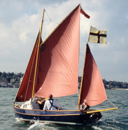 Drascombe coaster sailboat under sail