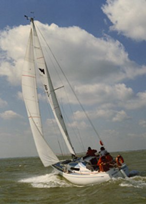 Hustler 255 sailboat under sail