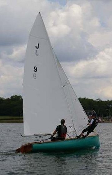 Jollyboat sailboat under sail