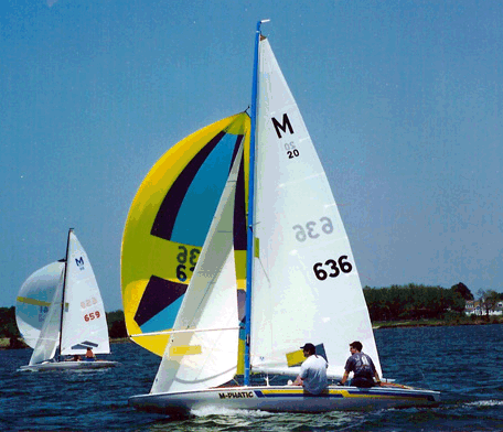 M 20 scow sailboat under sail