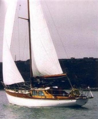 Poole one design sailboat under sail