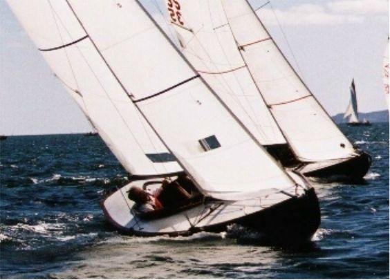 Sunbeam one design sailboat under sail